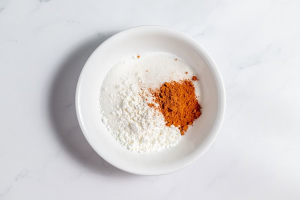 sugar, cornstarch and cinnamon in a bowl
