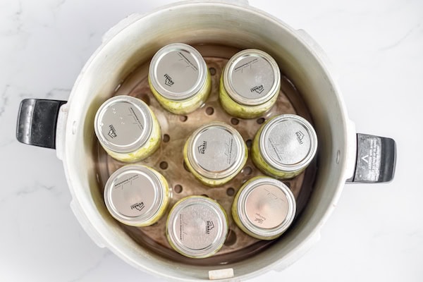 jars of cabbage in pressure canner ready to can