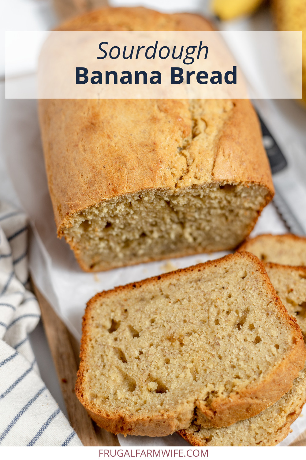 Image, taken from an upper angle, shows a loaf of sourdough banana break on a cooling rack with several slices cut off of it. Text above reads "Sourdough Banana Bread"