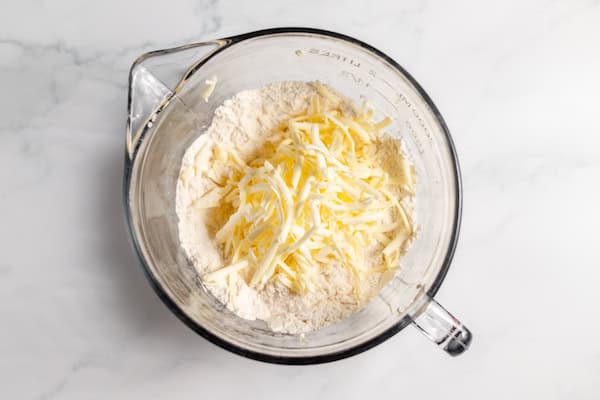 butter grated over flour mixture