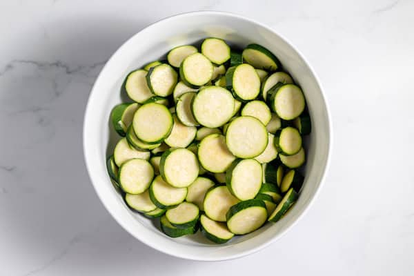 large bowl of sliced zucchini