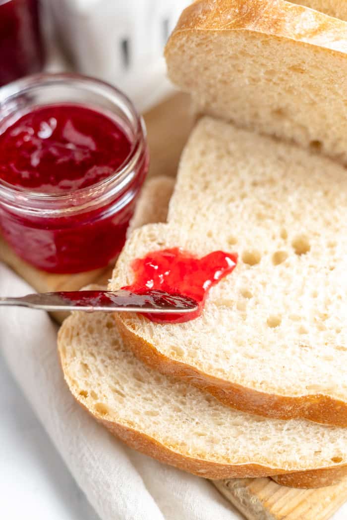 spreading jam on bread