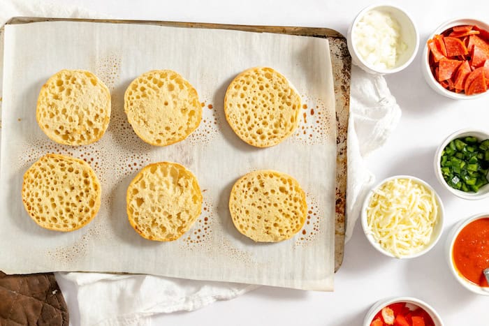 toasted english muffins ready for pizza toppings