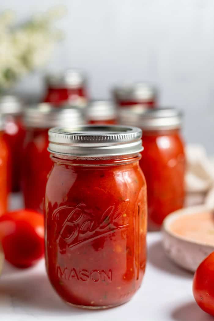 jars of canned tomato soup on a counter top