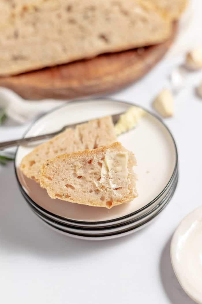 sliced rosemary bread with butter