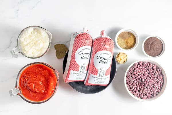 Image, taken from above, shows the ingredients for chili con carne on a table