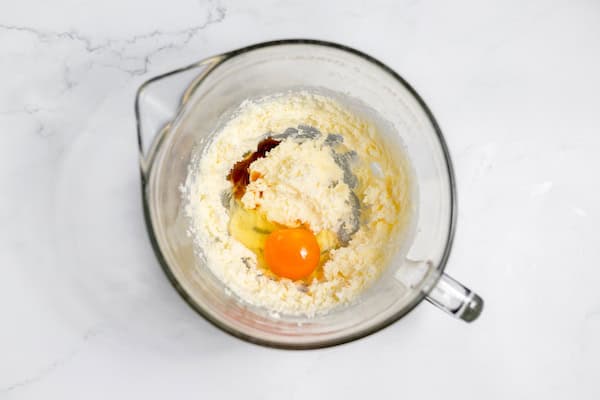 Image, taken from above, shows a mixing bowl of the wet ingredients for Earl Grey cookies.