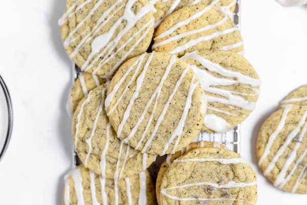 Image shows freshly baked Earl Grey cookies with lavender glaze on them