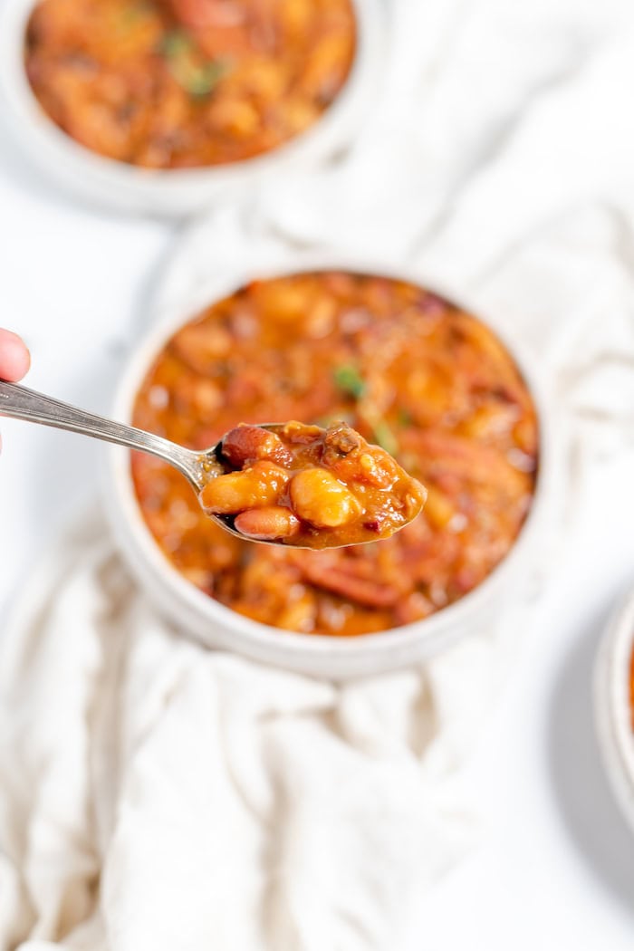 Image shows a close up of a spoonful of 15 bean and ham soup close up