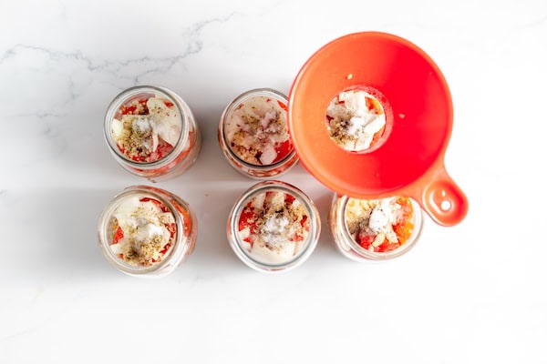 ingredients for lentil soup layered in jars