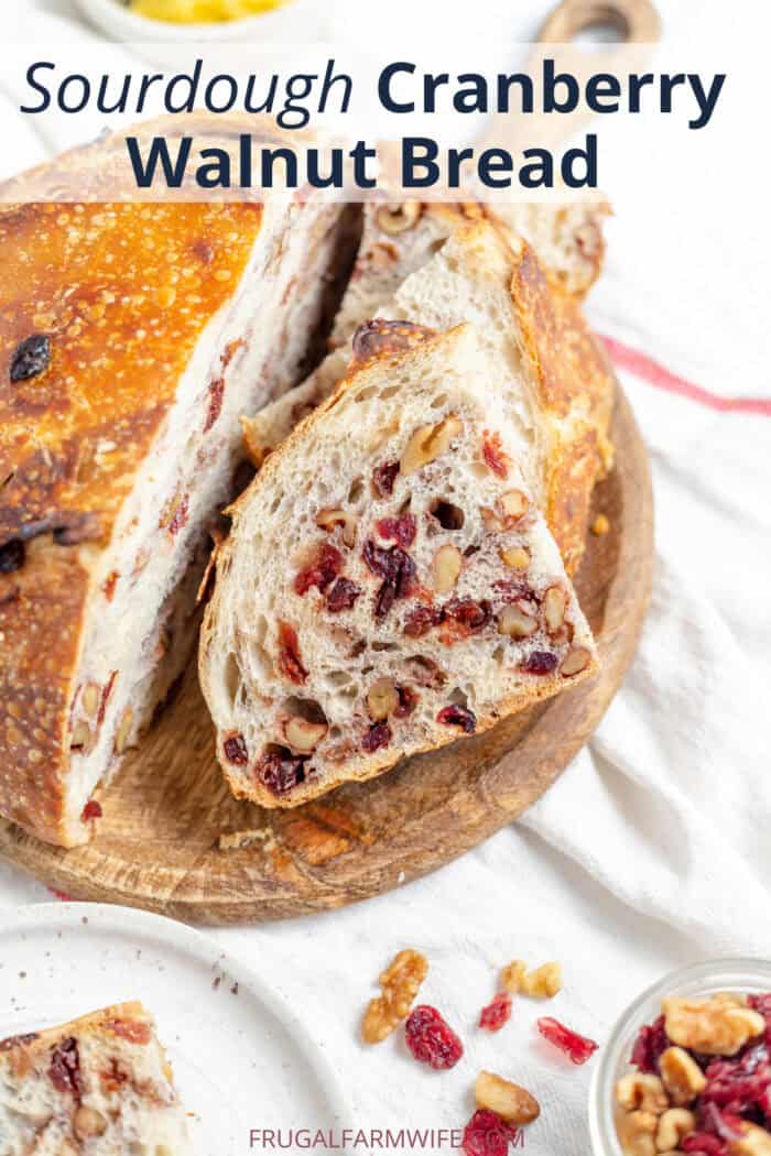 Cranberry walnut sourdough bread on a cutting board