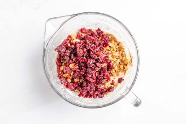 cranberries and walnuts on top of bread dough