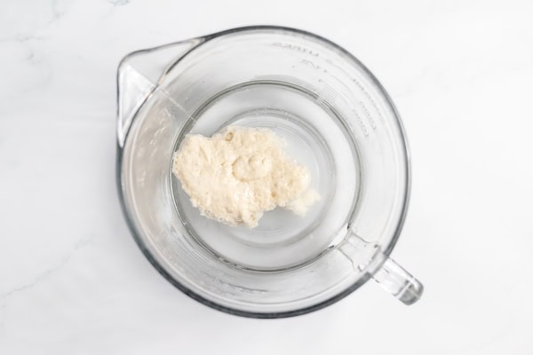 sourdough starter floating on water in a bowl