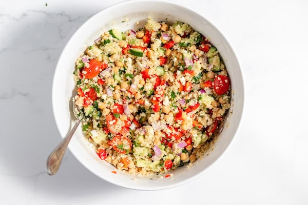 chickpea quinoa salad tossed together, ready to serve.