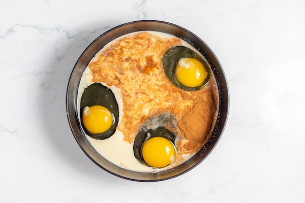 eggs, milk, and cinnamon in a bowl for french toast