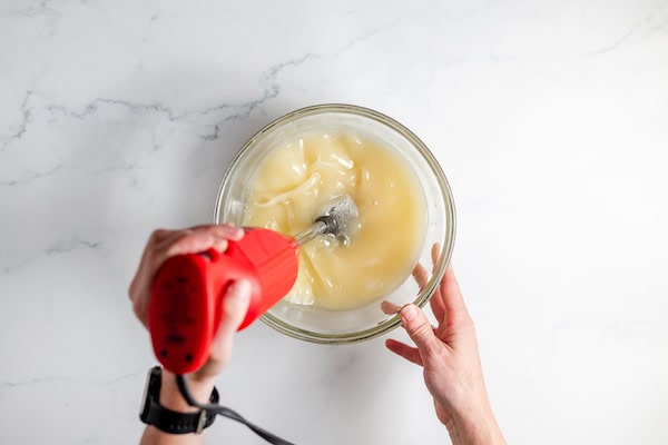 stirring soap mixture with an immersion blender