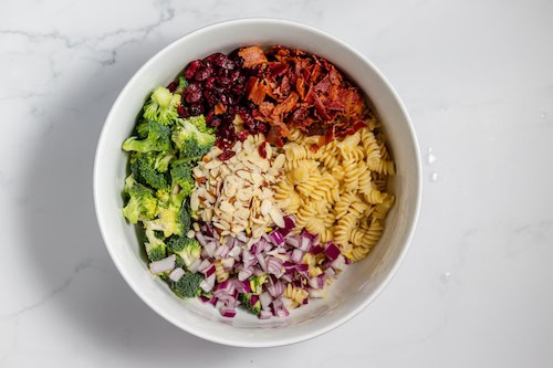 main ingredients of broccoli pasta salad in a bowl