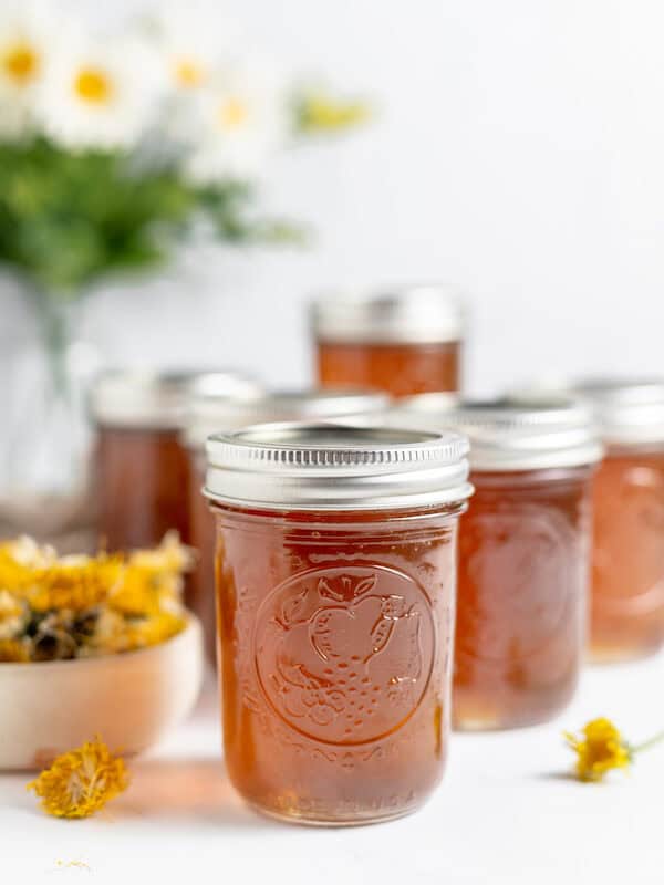 dandelion jelly in jars on a table