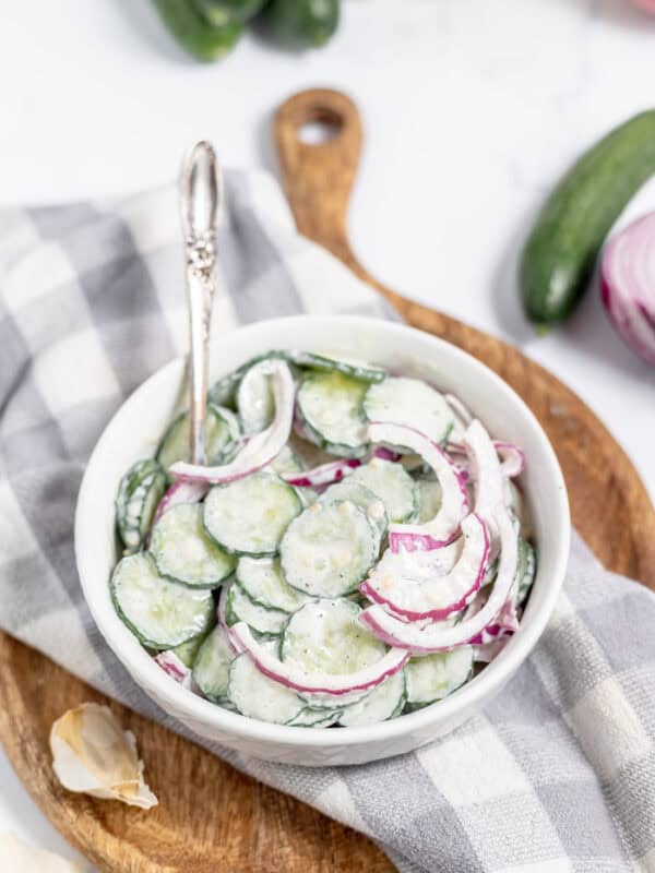 bowl of creamy cucumbers salad