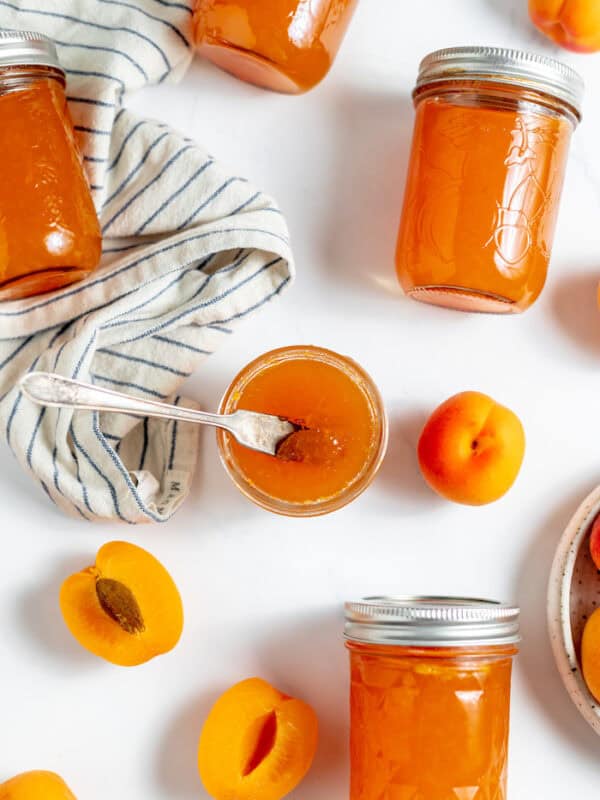 table full of apricot jam jars