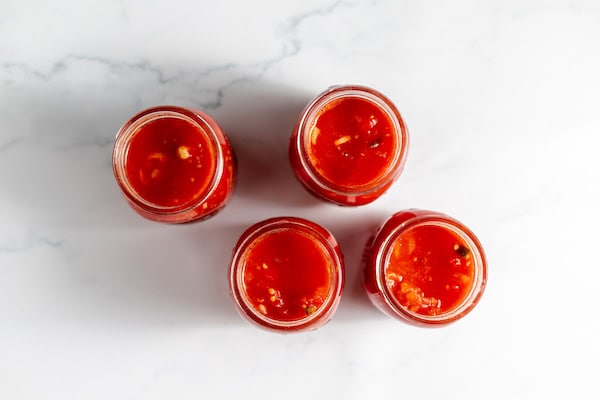 jars of stewed tomatoes ready to can
