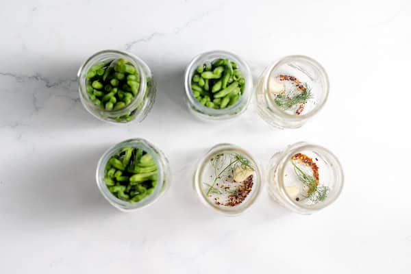 packing green beans into jars