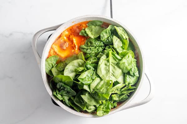 ravioli and spinach in soup