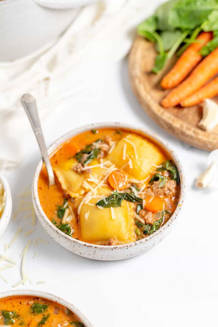 bowl of ravioli soup with parmesan