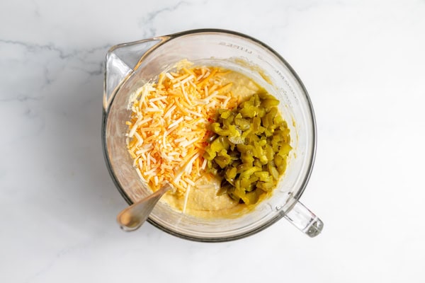 cheese and peppers on cornbread batter