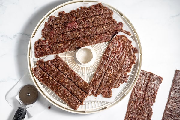 jerky in the dehydrator to dry