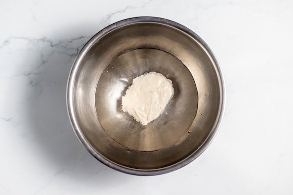 starter and water together in a bowl