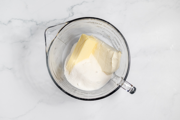 butter, cream cheese, sugar in a bowl together