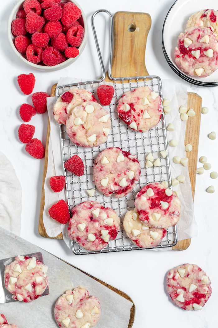 raspberry cheesecake cookies on a cutting board