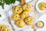 sourdough garlic knots on a cutting board with garlic butter