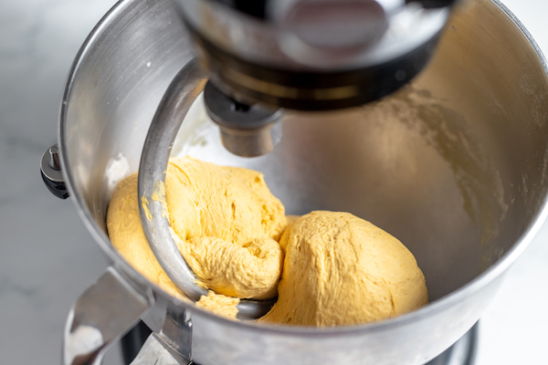 kneading pumpkin cinnamon roll dough